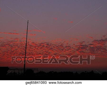 Clouds in the sky at sunset View Large Photo Image Stock Image - Clouds in the sky at sunset. Fotosearch
