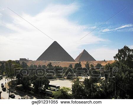 Stock Photography - Clouds over pyramids, Giza Pyramids, Giza, Cairo, Egypt. Fotosearch