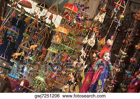 Stock Photograph - Decorations hanging at a market stall, Pushkar, Rajasthan, India. Fotosearch