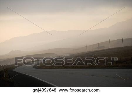Empty stretch of road at dusk View Large Photo Image Stock Photo - Empty stretch of road at dusk. Fotosearch