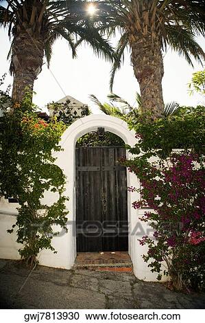 Facade of wooden doors in a stucco arch, Los Angeles, California, USA View Large Photo Image Stock Image - Facade of wooden doors in a stucco arch, Los Angeles, California, USA. Fotosearch
