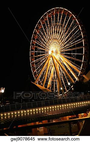 Stock Photography - Ferris wheel lit up at night, Navy Pier Park, Chicago, Illinois, USA. Fotosearch