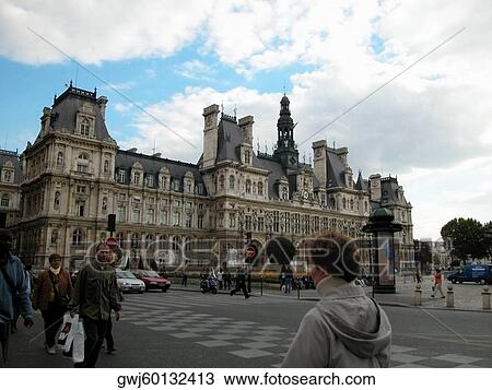 Stock Image - Group of people crossing a road, Paris, France. Fotosearch