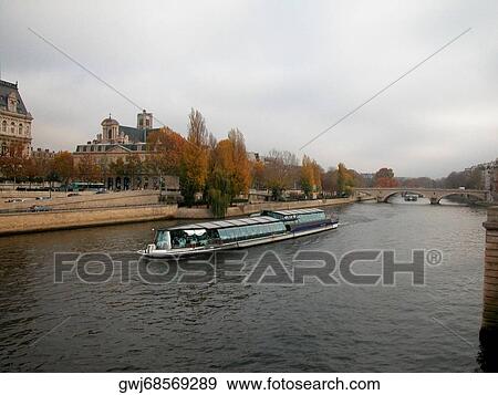 Group of people on a ferry in a river, Seine River, Paris, France View Large Photo Image Stock Photo - Group of people on a ferry in a river, Seine River, Paris, France. Fotosearch