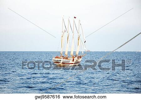 Group of people on a sailboat in a lake, Lake Michigan, Chicago, Illinois, USA View Large Photo Image Stock Photograph - Group of people on a sailboat in a lake, Lake Michigan, Chicago, Illinois, USA. Fotosearch