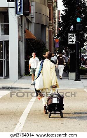 Picture - Group of people walking on a sidewalk, Chicago, Illinois, USA. Fotosearch