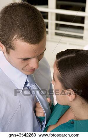 High angle view of a businesswoman holding a businessman by his tie View Large Photo Image Stock Image - High angle view of a businesswoman holding a businessman by his tie. Fotosearch