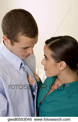 High angle view of a businesswoman holding a businessman by his tie View Large Photo Image Stock Photography - High angle view of a businesswoman holding a businessman by his tie. Fotosearch