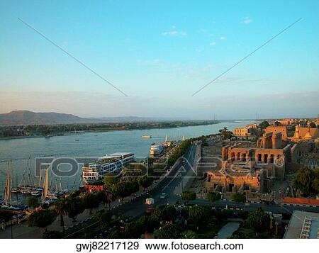 High angle view of a city on the banks of a river, Nile River, Luxor, Egypt View Large Photo Image Stock Photo - High angle view of a city on the banks of a river, Nile River, Luxor, Egypt. Fotosearch