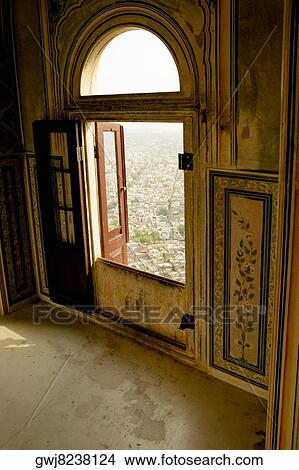 High angle view of a city seen through an arched window of a fort, Nahargarh Fort, Jaipur, Rajasthan, India View Large Photo Image Picture - High angle view of a city seen through an arched window of a fort, Nahargarh Fort, Jaipur, Rajasthan, India. Fotosearch