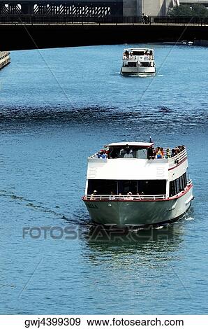 High angle view of a group of people on a boat in a river, Chicago River, Chicago, Illinois, USA View Large Photo Image Stock Photo - High angle view of a group of people on a boat in a river, Chicago River, Chicago, Illinois, USA. Fotosearch