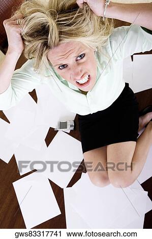 High angle view of a mid adult woman with her hands in her hair View Large Photo Image Stock Image - High angle view of a mid adult woman with her hands in her hair. Fotosearch