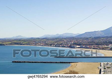 Picture - High angle view of a pier on a coast, Spain. Fotosearch