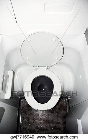 High angle view of a toilet in an airplane View Large Photo Image Stock Image - High angle view of a toilet in an airplane. Fotosearch
