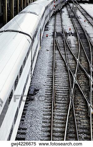 High angle view of a train at a railroad station View Large Photo Image Stock Photography - High angle view of a train at a railroad station. Fotosearch