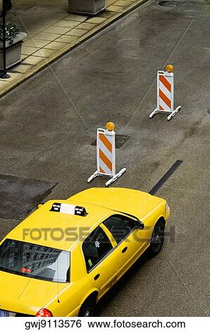 High angle view of a yellow taxi moving on the street, Chicago, Illinois, USA View Large Photo Image Stock Photograph - High angle view of a yellow taxi moving on the street, Chicago, Illinois, USA. Fotosearch