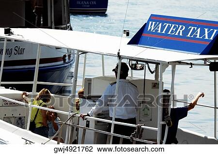 High angle view of four people in a water taxi, Chicago River, Chicago, Illinois, USA View Large Photo Image Stock Image - High angle view of four people in a water taxi, Chicago River, Chicago, Illinois, USA. Fotosearch