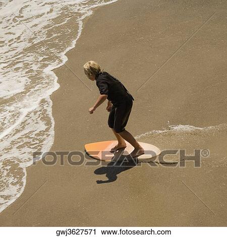 High angle view of two boogie boarder's on the beach View Large Photo Image Stock Image - High angle view of two boogie boarder's on the beach. Fotosearch