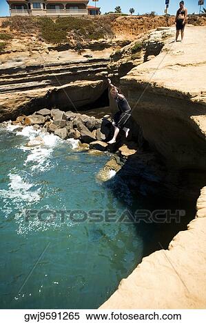 High angle view of two people standing on a reef overlooking an inlet, Coronado Reefs, San Diego, California, USA View Large Photo Image Stock Photography - High angle view of two people standing on a reef overlooking an inlet, Coronado Reefs, San Diego, California, USA. Fotosearch
