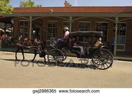 Horse cart moving on a street View Large Photo Image Stock Photography - Horse cart moving on a street. Fotosearch