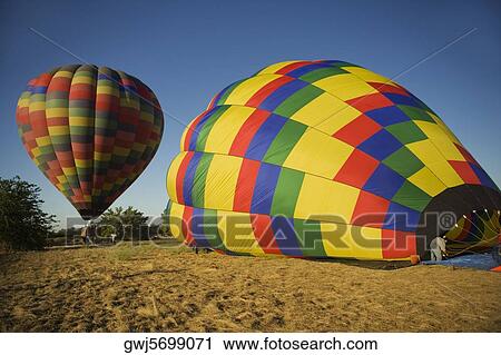 Hot air balloon landing View Large Photo Image Stock Image - Hot air balloon landing. Fotosearch