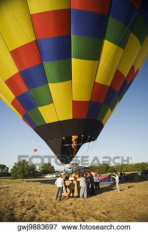 Stock Photo - Hot air balloon preparing to take off. Fotosearch