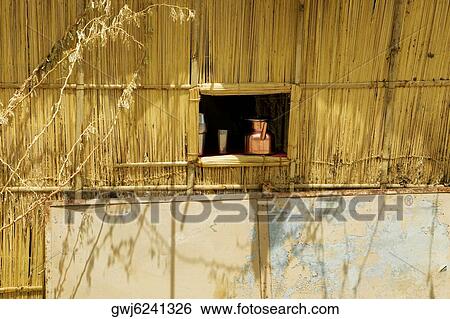 Jug and cup in the window of a thatched hut, Pushkar, Rajasthan, India View Large Photo Image Stock Photograph - Jug and cup in the window of a thatched hut, Pushkar, Rajasthan, India. Fotosearch