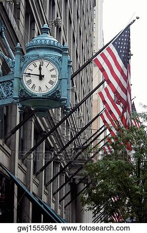 Low angle view of a clock on a building, Marshall Field's Building, Chicago, Illinois, USA View Large Photo Image Picture - Low angle view of a clock on a building, Marshall Field's Building, Chicago, Illinois, USA. Fotosearch