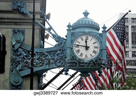 Low angle view of a clock on a building, Marshall Field's Building, Chicago, Illinois, USA View Large Photo Image Stock Photo - Low angle view of a clock on a building, Marshall Field's Building, Chicago, Illinois, USA. Fotosearch