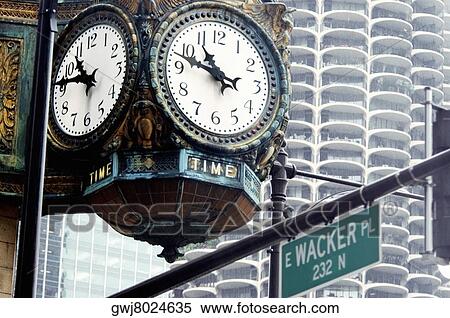 Low angle view of a clock on the side of a building, Chicago, Illinois, USA View Large Photo Image Stock Photography - Low angle view of a clock on the side of a building, Chicago, Illinois, USA. Fotosearch