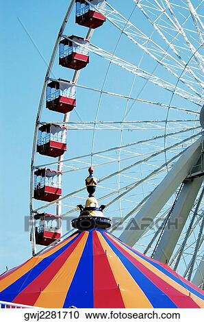 Low angle view of a ferris wheel View Large Photo Image Stock Image - Low angle view of a ferris wheel. Fotosearch
