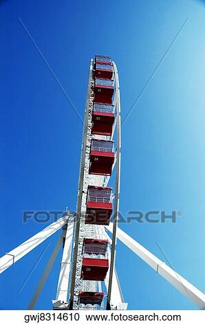 Low angle view of a ferris wheel View Large Photo Image Stock Image - Low angle view of a ferris wheel. Fotosearch