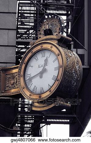 Low angle view of a gold clock on a building, Chicago, Illinois, USA View Large Photo Image Stock Photograph - Low angle view of a gold clock on a building, Chicago, Illinois, USA. Fotosearch