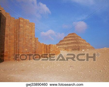 Stock Image - Low angle view of a pyramid in an arid landscape, The Step Pyramid Of Zoser, Saqqara, Egypt. Fotosearch