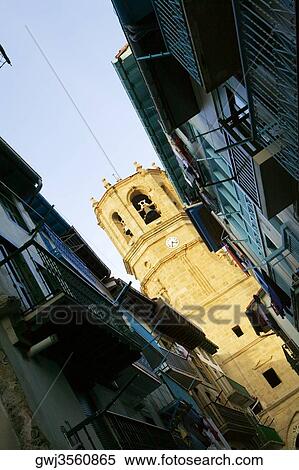 Low angle view of a tower between two buildings, Spain View Large Photo Image Stock Photography - Low angle view of a tower between two buildings, Spain. Fotosearch