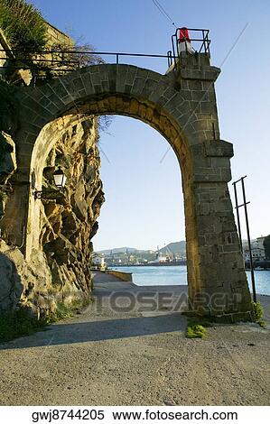 Low angle view of an arched gateway on a street, Spain View Large Photo Image Stock Photography - Low angle view of an arched gateway on a street, Spain. Fotosearch