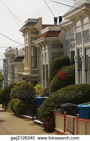 Low angle view of buildings at a road side View Large Photo Image Stock Photography - Low angle view of buildings at a road side. Fotosearch