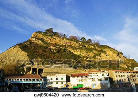 Low angle view of buildings at the foot of a hill, Spain View Large Photo Image Stock Image - Low angle view of buildings at the foot of a hill, Spain. Fotosearch