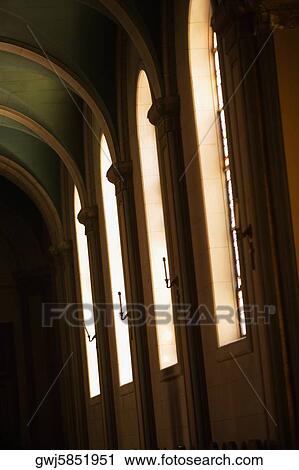 Low angle view of candlestick holders inside a church View Large Photo Image Stock Image - Low angle view of candlestick holders inside a church. Fotosearch