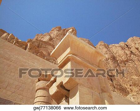 Low angle view of columns in front of a stone wall, Egypt View Large Photo Image Stock Photograph - Low angle view of columns in front of a stone wall, Egypt. Fotosearch
