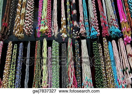 Low angle view of necklaces at a store, Pushkar, Rajasthan, India View Large Photo Image Stock Photo - Low angle view of necklaces at a store, Pushkar, Rajasthan, India. Fotosearch