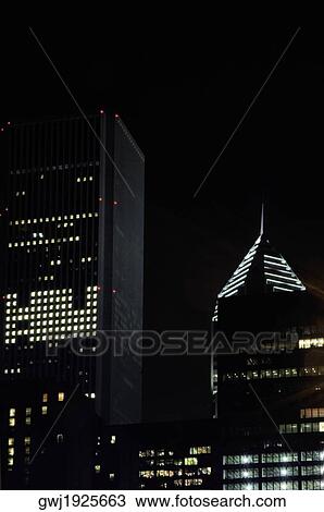 Low angle view of skyscrapers at night, Chicago, Illinois, USA View Large Photo Image Stock Image - Low angle view of skyscrapers at night, Chicago, Illinois, USA. Fotosearch