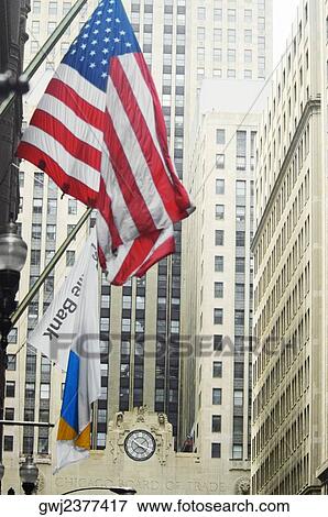 Low angle view of the American flag on a building, Chicago Board of Trade, Chicago, Illinois, USA View Large Photo Image Stock Photo - Low angle view of the American flag on a building, Chicago Board of Trade, Chicago, Illinois, USA. Fotosearch