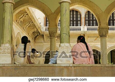 Low angle view of two women sitting inside a museum, Government Central Museum, Jaipur, Rajasthan, India View Large Photo Image Stock Image - Low angle view of two women sitting inside a museum, Government Central Museum, Jaipur, Rajasthan, India. Fotosearch