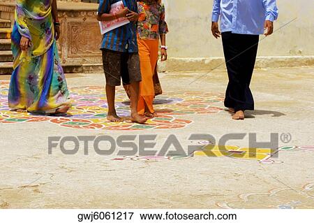 Low section view of four people walking, Pushkar, Rajasthan, India View Large Photo Image Stock Photo - Low section view of four people walking, Pushkar, Rajasthan, India. Fotosearch