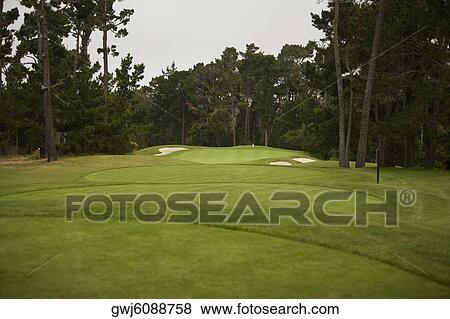 Panoramic view of a golf course View Large Photo Image Stock Photo - Panoramic view of a golf course. Fotosearch