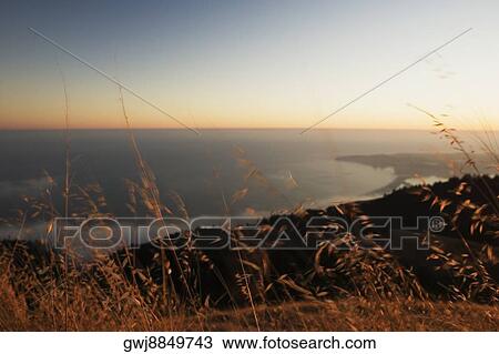 Panoramic view of the sea at dusk View Large Photo Image Stock Image - Panoramic view of the sea at dusk. Fotosearch
