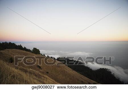 Stock Photo - Panoramic view of the sea at dusk. Fotosearch