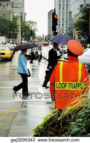 Pedestrian's walking in the rain, Michigan Avenue, Chicago, Illinois, USA View Large Photo Image Stock Image - Pedestrian's walking in the rain, Michigan Avenue, Chicago, Illinois, USA. Fotosearch
