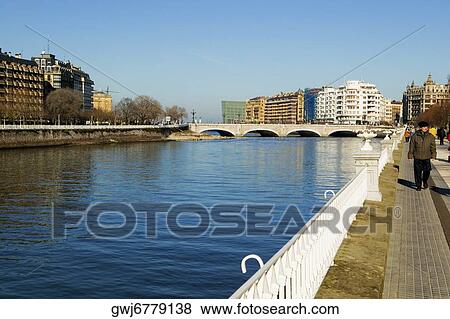 People walking on a waterfront, Spain View Large Photo Image Stock Photo - People walking on a waterfront, Spain. Fotosearch